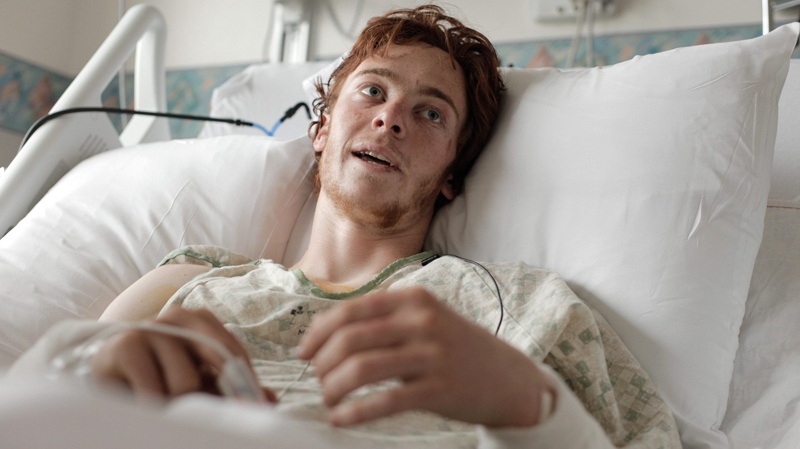 Samuel Gottsegen, 17, recounts his experiences as one of the victims of a bear attack that occurred near Talkeetna, Alaska, as he recovers in an Anchorage hospital on Monday July 25, 2011. Gottsegen was taking part in an outdoor education course from the National Outdoor Leadership School. (AP / Loren Holmes)