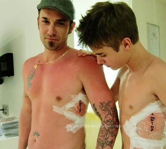 Justin Bieber getting tattooed with his dad during a recent trip to Israel
