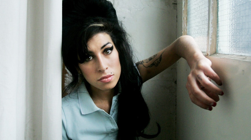British singer Amy Winehouse poses for photographs at a studio in north London, Friday, Feb. 16, 2007. (AP / Matt Dunham)