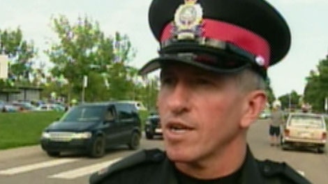 Duty Officer Regan James with Edmonton police speaks to CTV News on Thursday, July 28, 2011. Officers are in the area of 58 St. and 93 A Ave. after an Amber Alert was issued for a little boy.