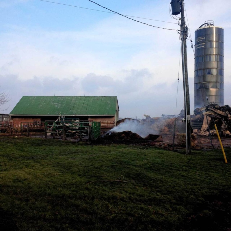 The aftermath of a fire on a farm southwest of Milverton, Ont. is seen on Thursday, Dec. 5, 2013. (Perth East Fire Chief Bill Hunter / Twitter)