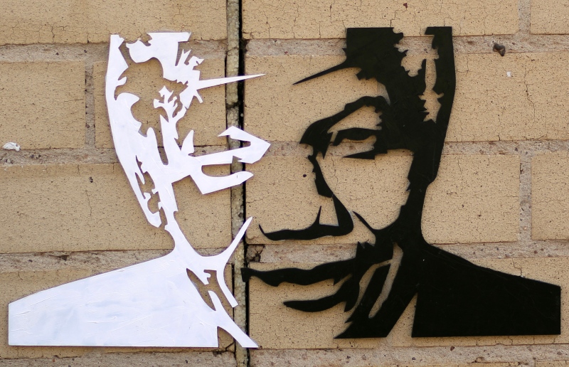 A portrait of former South African President Nelson Mandela is shown outside a hospital in Pretoria, South Africa in this July 2013 file photo. (AP Photo/Themba Hadebe)