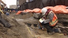 Archaeologists dig at the site of Ottawa's first Christian graveyard unearthed below Queen St. in Ottawa downtown. 