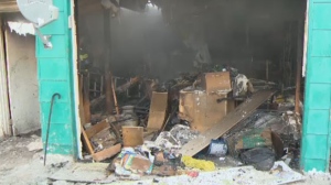 The Greenwood Avenue garage fire destroyed a family's Christmas presents in Winnipeg, Man. on Dec. 6, 2013.