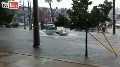 Flooding caused traffic problems on several roads after heavy rain in Kingston, Friday, July 29, 2011. (YouTube)
