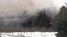 Firefighters battle farmhouse blaze.
