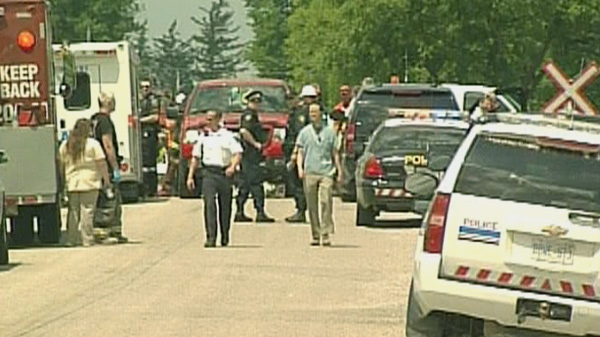 Emergency crews at the scene of a collision and train derailment near Glencoe, Ont. on Friday, July 29, 2011.