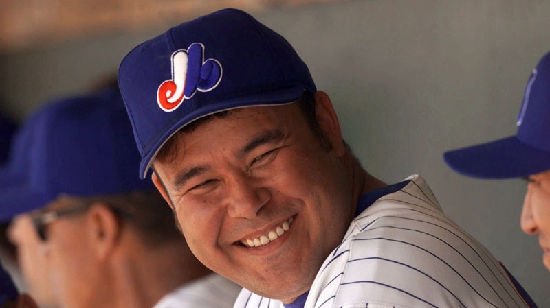 Montreal Expos' Hideki Irabu chats with teammates in the dugout during a game against the New York Mets in Jupiter, Fla. Monday, March 6, 2000. (AP Photo/Roberto Borea)