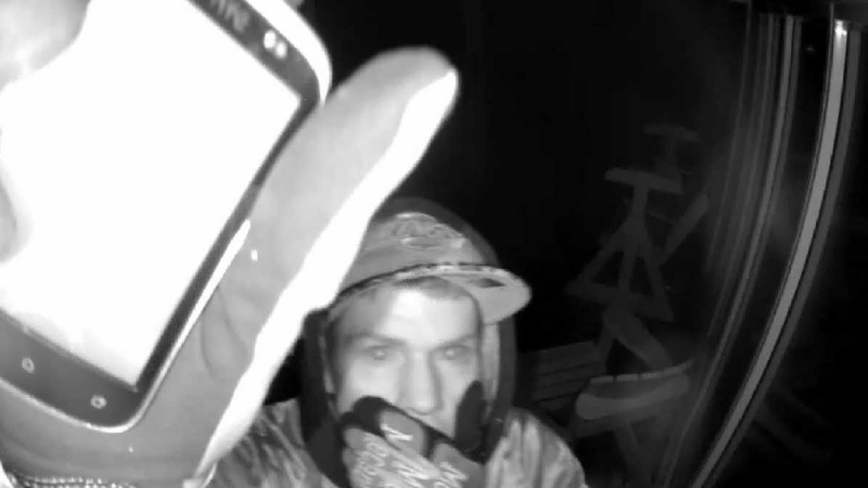 An image from video released by Essex County OPP shows a suspect outside a Leamington, Ont. residence that was robbed.