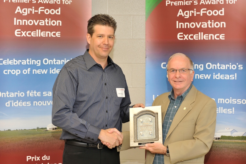 Dean Tiessen accepts the 2010 Premier's Award for Agri-Food Innovation Excellence in this image provided by the Ontario Ministry of Agriculture and Food.