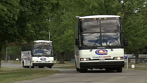 Buses leave the former Rideau Regional Centre in Smiths Falls to take hundreds of Deer Lake fire evacuees back home on Tuesday, August 2, 2011.