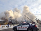 Thick smoke fills the sky in downtown St. Thomas Thursday, Dec. 12, as fire crews continue to work on a second blaze on New Street. (Talia Ricci/ CTV London)