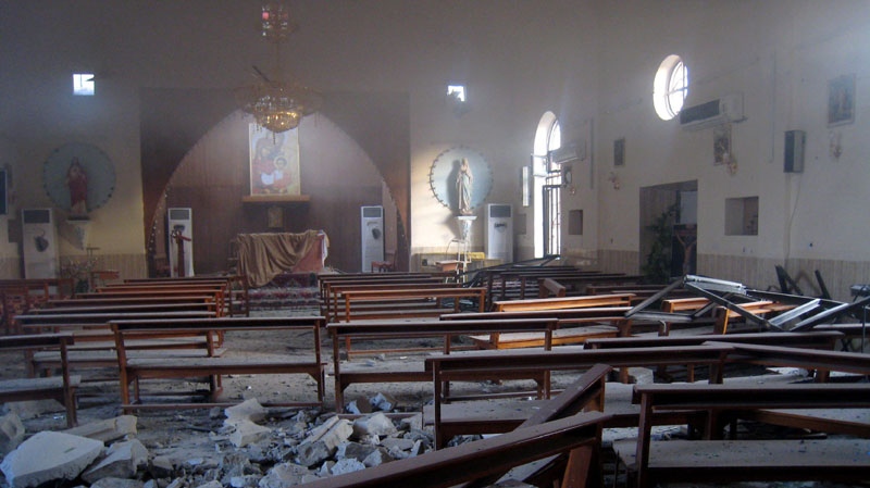 The damaged interior of the holy family Syrian Catholic Church after an early morning car bomb attack in Kirkuk, 290 kilometres north of Baghdad, Iraq, Tuesday, Aug. 2, 2011. (AP Photo/Emad Matti)