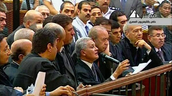 This video image taken from Egyptian State Television shows a defense lawyer speaking during the trial of Hosni Mubarak's security chief Habib el-Adly and six top police officers charged with ordering the use of deadly force against protesters during this year's uprising in Egypt, in a Cairo courtroom Thursday Aug. 4, 2011. (AP / Egyptian State TV)