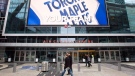 Pedestrians walk past the Air Canada Centre as a screen projects an image of the Toronto Maple Leafs logo in Toronto Wednesday, December 1, 2010.  (Darren Calabrese / THE CANADIAN PRESS)