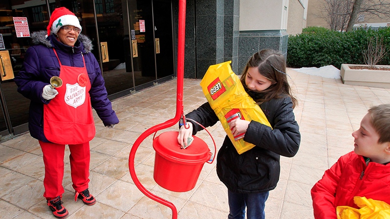 Young shopper donating to the Salvation Army