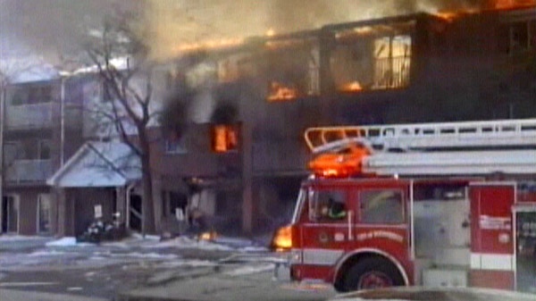 Fire crews respond to an explosion and fire at an apartment complex in Woodstock, Ont. on Sunday, March 27, 2011.