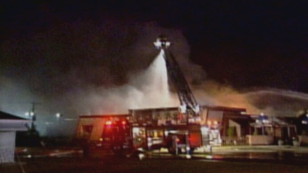 Fire crews respond to a blaze at The Iron Grill Restaurant in Woodstock, Ont. on Aug. 12, 2009.