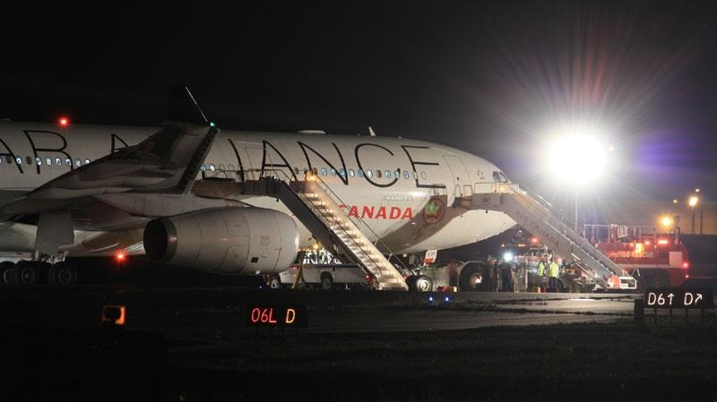 An Air Canada jet is seen at Pearson Airport in the early hours of Friday, Aug. 5, 2011. (Tom Stefanac / CTV News)