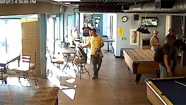 An image taken from video released by the Sarnia Police Service shows a male in a yellow shirt wanted in connection with a theft at Lambton College on Sept. 3, 2013.