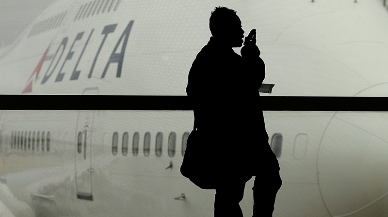 Traveller awaits Delta Air Lines flight
