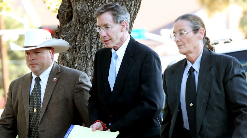 Warren Jeffs is taken into the side entrance of the Tom Green County Courthouse, Monday, Aug. 8, 2011 in San Angelo, Texas. (AP / San Angelo Standard-Times, Patrick Dove)