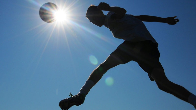 In this July 20, 2011 file photo, a member of the Salina South High School soccer team works out for conditioning training in Salina, Kansas. (AP / Salina Journal, Tom Dorsey)