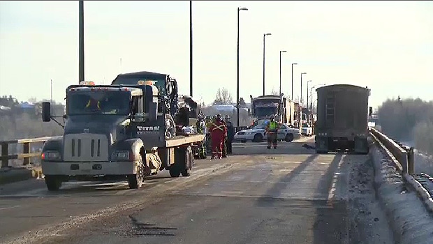 RCMP and cleanup crews on the scene of a serious crash near Fort Saskatchewan, on the Hwy 15 bridge over the North Saskatchewan River Thursday, December 19.