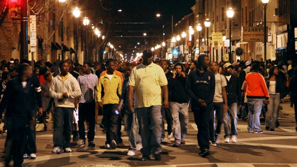 Young people fill South Street during a flash mob incident that involved thousands and closed the street to traffic from Front Street to Broad in Philadelphia, March 20, 2010. (AP / The Philadelphia Inquirer, Laurence Kesterson)