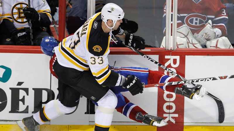 Montreal Canadiens' Max Pacioretty is hit by Boston Bruins' Zdeno Chara during second  period NHL hockey action in Montreal on March 8, 2011. (Paul Chiasson / THE CANADIAN PRESS)
