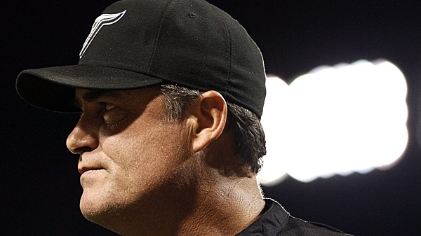 Toronto Blue Jays manager John Farrell walks off the field after being ejected by home plate umpire Brian Knight in the seventh inning of a baseball game against the Baltimore Orioles in Baltimore on Friday, Aug. 5, 2011. (AP Photo/Patrick Semansky)