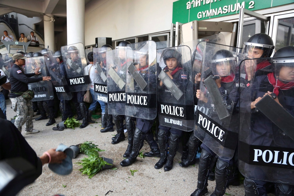 Thai riot policemen after scuffle with protesters