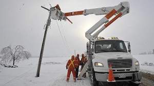 Crews are out again today in the Caledon area repairing power lines and hydro poles after an ice storm swept across Southern Ontario Dec. 21, 2013. (Hydro One photo)