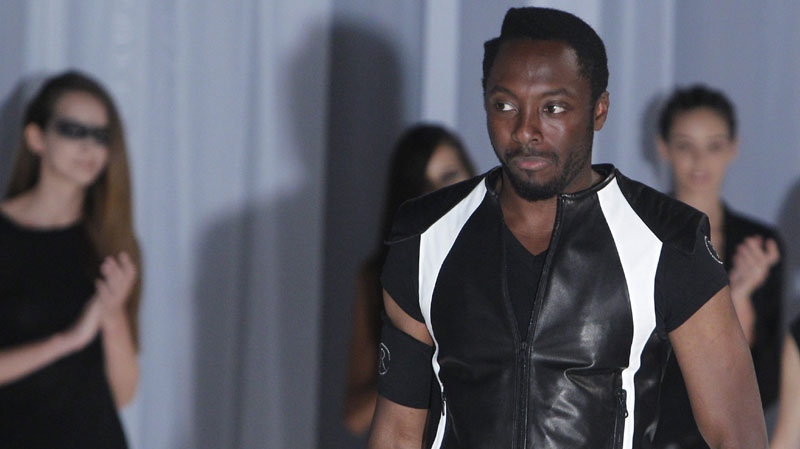 Will.I.Am of the hip hop group Black Eyed Peas wears a creation by Japanese fashion designer Rynshu as part of spring-summer 2012 men's fashion collection, in Paris, Sunday, June 26, 2011. (AP Photo/Jacques Brinon)