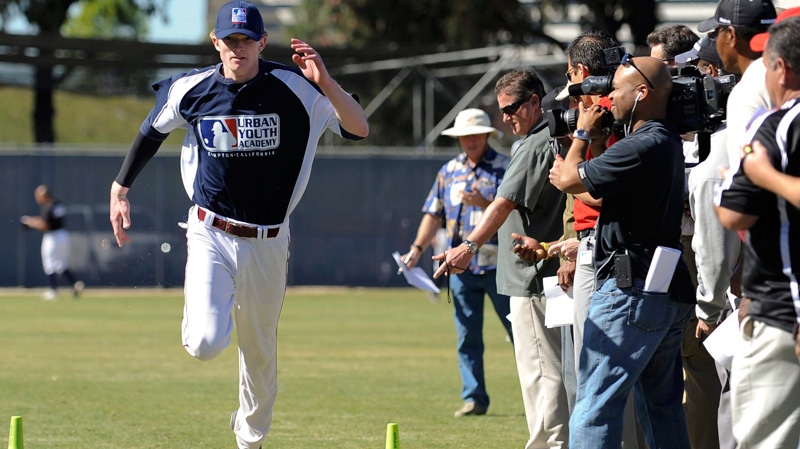 Trevor Gretzky, 18, son of Hockey great Wayne Gretzky runs the 60 yard dash as scouts look on during the fifth annual Southern California Invitational Showcase held by the Major League Baseball Scouting Bureau at the MLB Urban Youth Academy in Compton, Calif., Saturday, Feb. 12, 2011. (AP / Gus Ruelas)