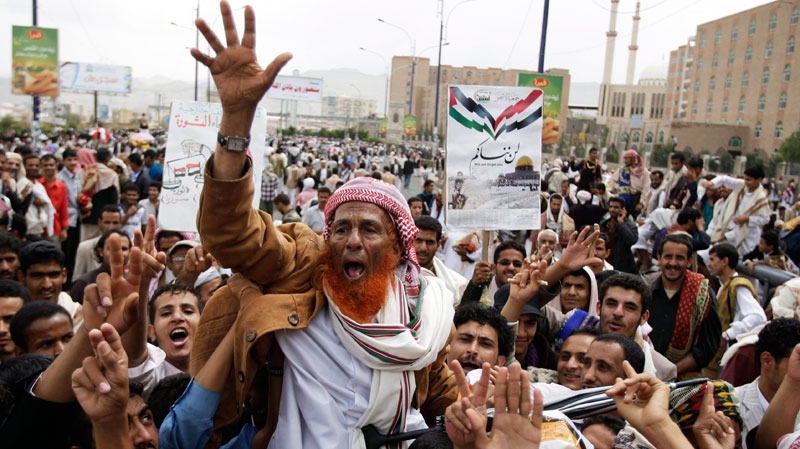An elderly anti-government protester react and shout slogans during a demonstration demanding the resignation of Yemen's President Ali Abdullah Saleh, in Sanaa, Yemen, Friday, Aug. 12, 2011. (AP / Hani Mohammed)