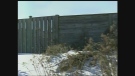 Gaps in a privacy fence, left, are seen next to a solid wood noise barrier along Veterans Memorial Parkway in London, Ont. on Friday, Jan. 3, 2014. (Daryl Newcombe / CTV London)