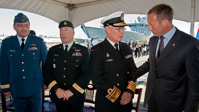 Lt.-Gen. Andre Deschamps, Chief of the Air Staff, Lt.-Gen. Peter Devlin, Chief of the Land Staff and Vice-Admiral Paul Maddison, Chief of the Maritime Staff, left to right, chat with Defence Minister Peter MacKay at a ceremony in Halifax on Tuesday, Aug. 16, 2011. (Andrew Vaughan / THE CANADIAN PRESS)