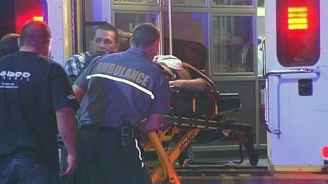 A bouncer is rushed to hospital after being shot in the chest on August 17, 2011.