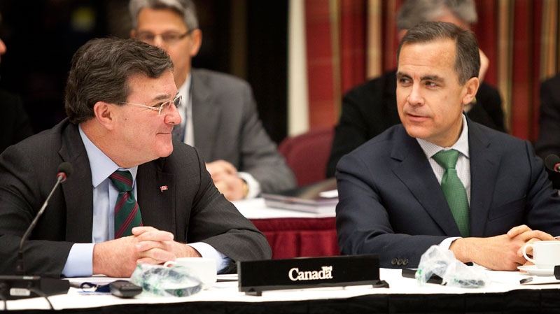 Federal Finance Minister Jim Flaherty, left, and Bank of Canada Governor Mark Carney prepare to meet provincial and territorial finance ministers to discuss pensions during a meeting in Kananaskis, Alta., Monday, Dec. 20, 2010. (Jeff McIntosh/ THE CANADIAN PRESS)