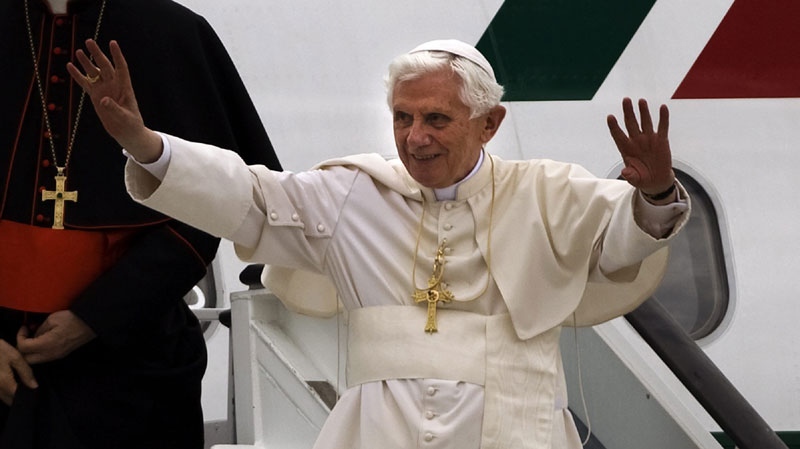 Pope Benedict XVI waves as he arrives at Madrid Barajas airport, Thursday, Aug. 18, 2011. The Pontiff arrived in the Spanish capital of Madrid for a four-day visit on the occasion of the Catholic Church's World Youth Day. (AP Photo/Emilio Morenatti) 