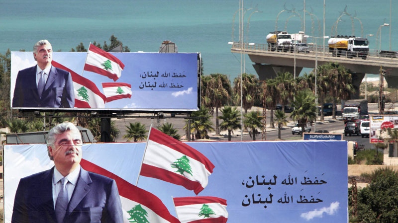 Billboards featuring the image of former Lebanese prime minister Rafik Hariri are seen in the southern port city of Sidon, Lebanon, Wednesday, Aug. 17, 2011. (AP Photo/Mohammed Zaatari)