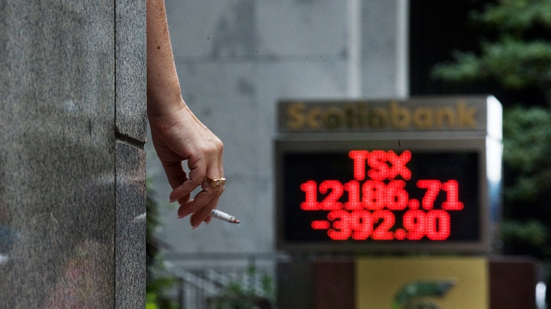 The numbers on the Scotiabank board on King Street in Toronto show the continued tumble of the TSX closing down 392.90 points on Thursday, Aug. 18 2011. (Aaron Vincent Elkaim / THE CANADIAN PRESS)