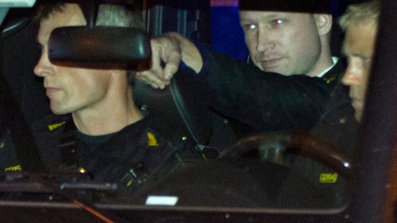 Terror-charged Anders Behring Breivik arrives in the back of a police car at the court in Oslo Friday, Aug. 19, 2011. (Scanpix / Thomas Winje Oeijord)