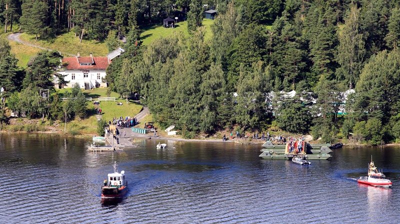 Survivors  and their relatives of the July 22 attack visit the island of Utoya in Norway Saturday Aug. 20 2011. (AP / Cornelius Poppe, Scanpix)