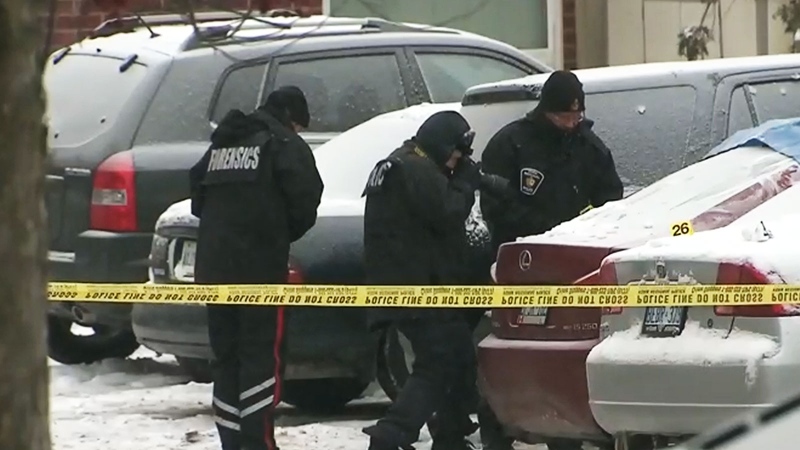 York Regional Police investigate the scene of two deaths in Richmond Hill, Ont. on Wednesday, Jan. 8, 2014.
