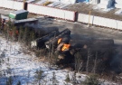 Derailed train cars burn in Plaster Rock, N.B., Wednesday, Jan. 8, 2014. (Tom Bateman / THE CANADIAN PRESS)