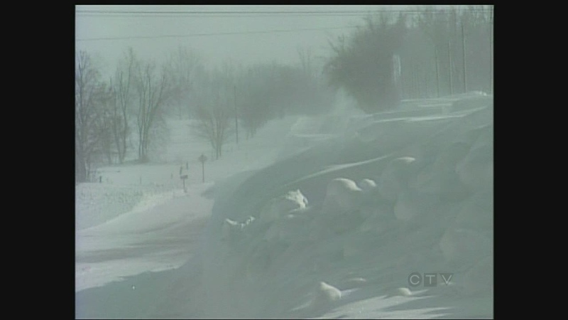 A huge snow drift blocks the roadway in Huron County, Ont. on Wednesday, Jan. 8, 2014. (Scott Miller / CTV London)