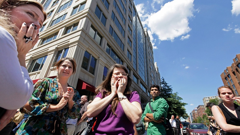 Office workers gather on the sidewalk in downtown Washington, Tuesday, Aug. 23, 2011, moments after a 5.9 magnitude tremor shook the city. (AP / J. Scott Applewhite)