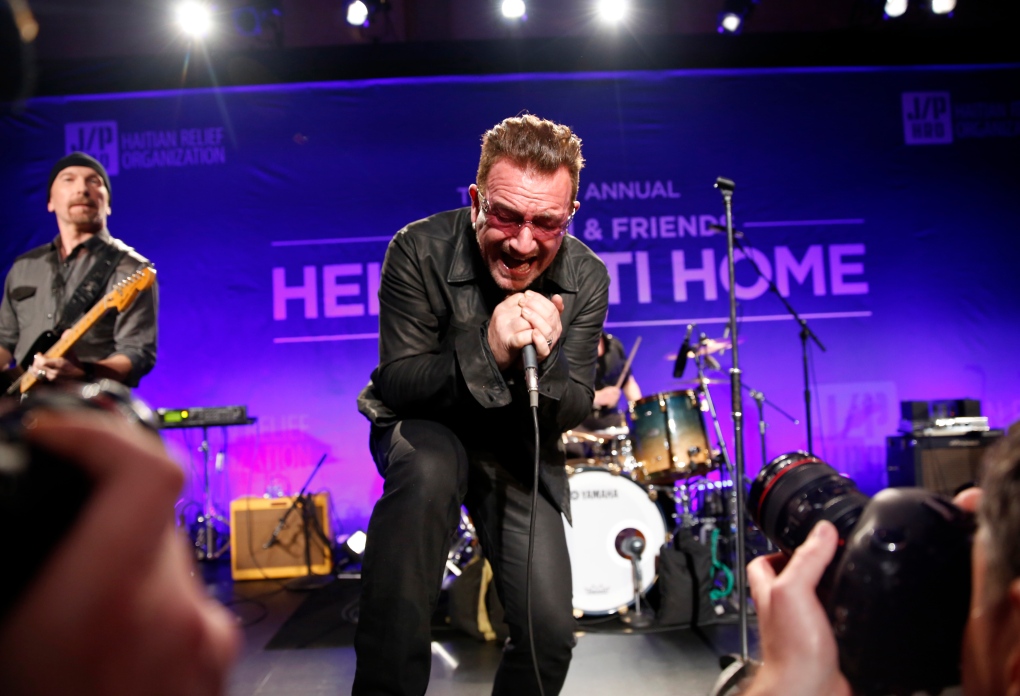 U2 performs at Haiti benefit